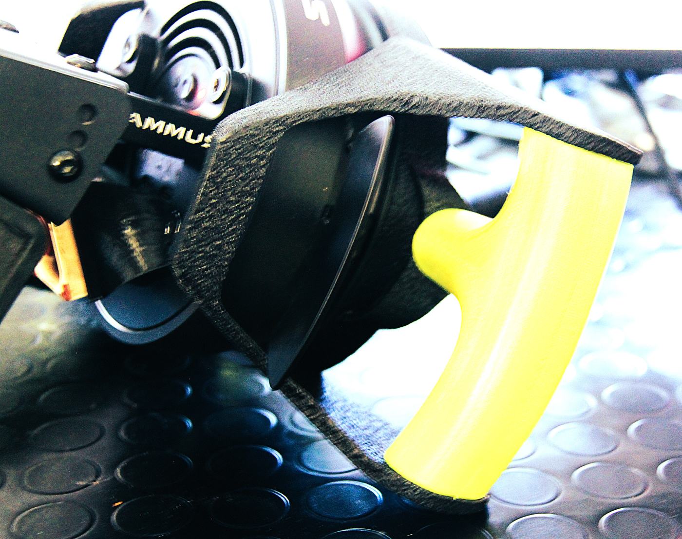 Rear three-quarter view showing the textured spoke plate and the grip